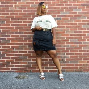 Distressed black denim skirt